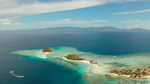 Aerial seascape island with white beach. bulog dos, philippines, palawan. 