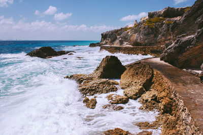 Waves splashing at rocky shore