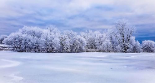 Scenic view of frozen lake against sky