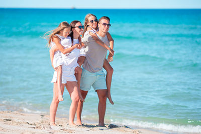 Rear view of people at beach