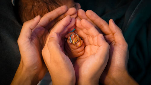 Close-up of woman holding hands