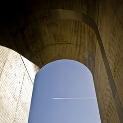 Low angle view of bridge against clear blue sky