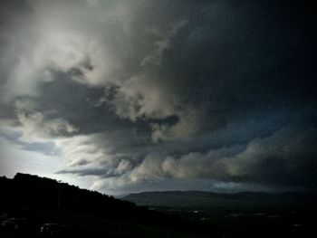 Scenic view of landscape against cloudy sky