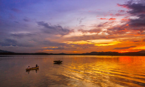 Scenic view of lake against sky during sunset