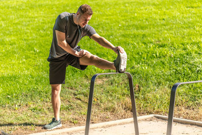 Full length of man running on grass