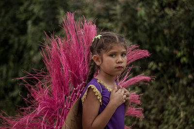 Portrait of girl with pink flowers