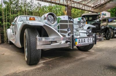 Vintage car parked on road in city