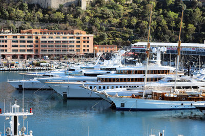 Boats moored at harbor