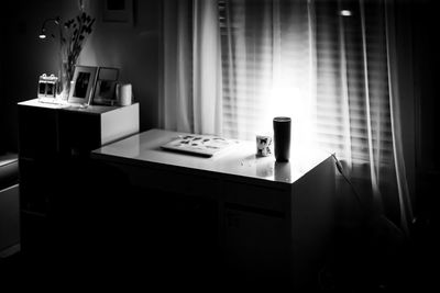 A view of small bedroom in b and w