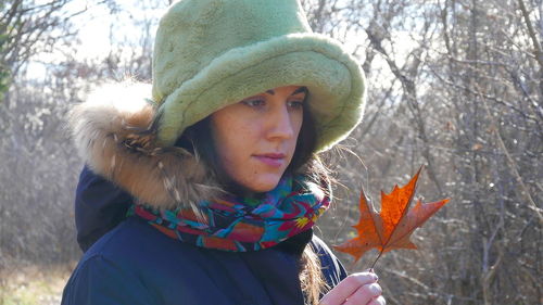 Portrait of woman in park during winter