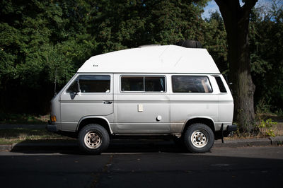 Side view of car parked on road