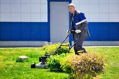 Side view of man working on field