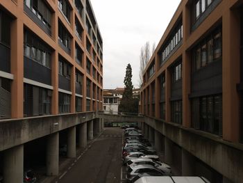 Street amidst buildings against sky in city