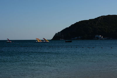 Scenic view of sea against clear blue sky