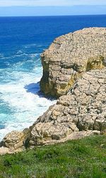 Scenic view of sea against blue sky