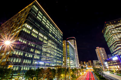 High angle view of illuminated buildings in city at night
