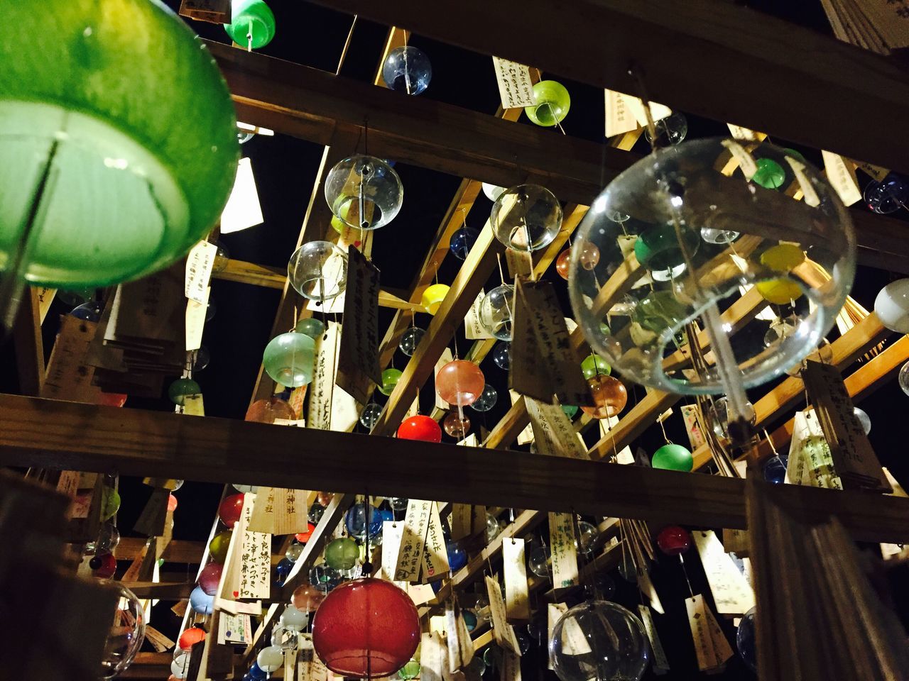 CLOSE-UP OF BOTTLES IN SHELF