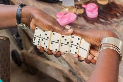 Close-up of woman holding dominos