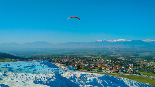 Scenic view of landscape against blue sky