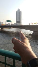 Cropped image of woman standing by river