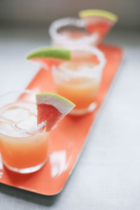 Close-up of orange juice on table