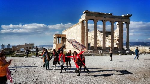 Tourists in front of building