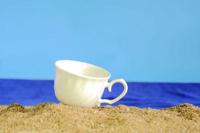 Close-up of coffee cup on table