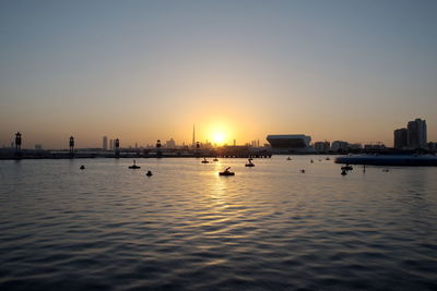 Scenic view of sea against clear sky during sunset