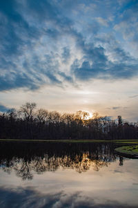 Scenic view of lake against sky during sunset