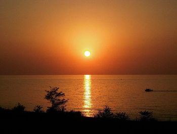 Scenic view of sea at sunset