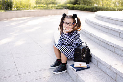 Portrait of young woman using mobile phone