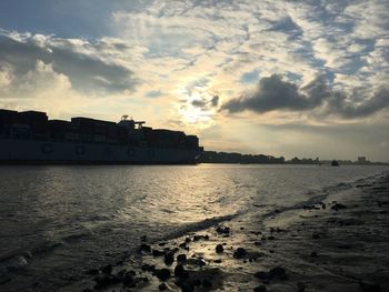 Scenic view of sea against cloudy sky