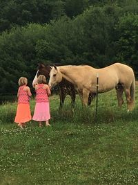 Full length of girl standing on field