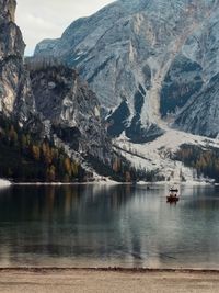 Scenic view of lake with mountain range in background
