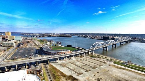 High angle view of bridge over sea against blue sky