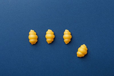 High angle view of multi colored candies against white background