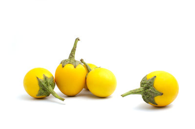 Close-up of fruits against white background