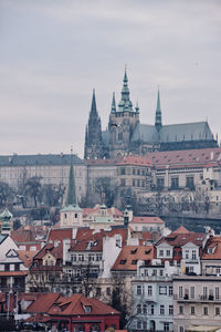 Buildings in city against sky