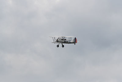 Low angle view of airplane flying in sky