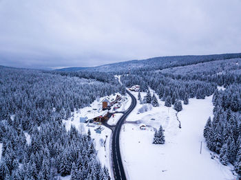 Aerial view of landscape against sky during winter