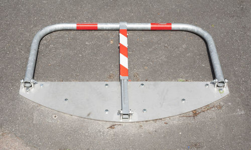 High angle view of metallic railing on road