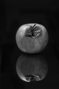 Close-up of apple against black background