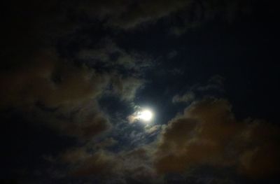 Low angle view of moon in sky at night