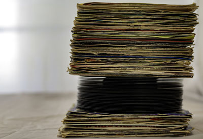 Close-up of stack of objects on table