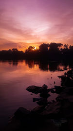 Scenic view of lake against sky during sunset