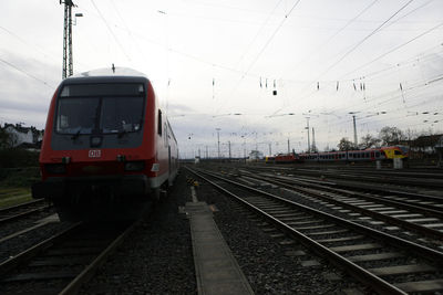 Train at railroad station against sky
