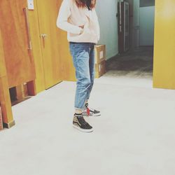 Low section of man standing on floor