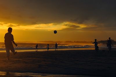 Silhouette of people on beach