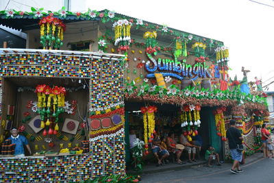 Group of people in market stall
