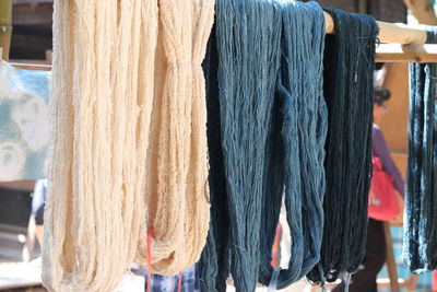 Close-up of clothes drying on display at store